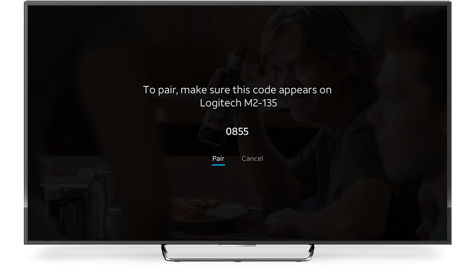 Screenshot of Bluetooth pairing screen for AT&T TV. Text on screen shows Bluetooth device name and 4-digit pairing code followed by two buttons, Pair and Cancel.
