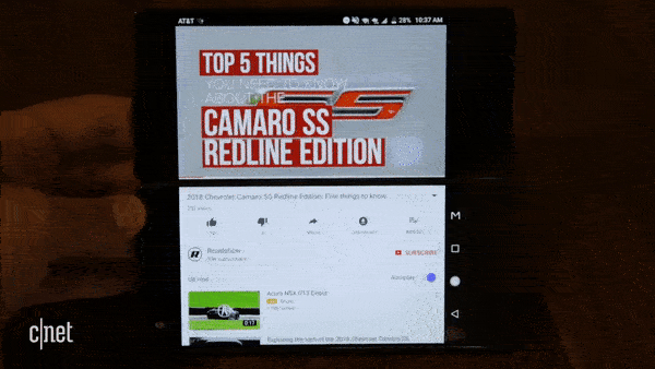 Animated GIF showing ZTE Axon M with YouTube in Extended Mode and landscape orientation. Video is playing on the top screen while the video informaiton is shown on the bottom screen.