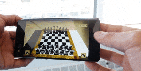 Animated GIF showing ZTE Axon M in Mirror mode with a chess app shown on each screen to highlight how two people can play a game across from each other.
