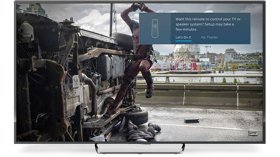 AT&T TV showing a notification in the top-right of the screen to program a remote to control a TV or speaker system. The notification says Want this remote to control your TV or speaker system? Setup may take a few minutes. Two selectable options follow: Let's do it and No thanks.